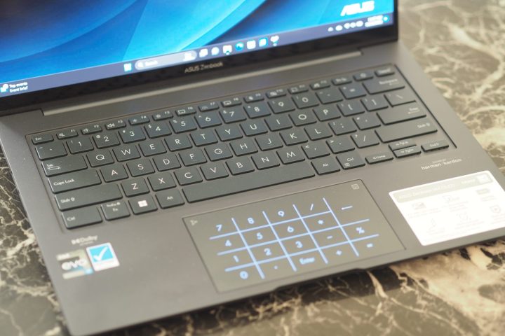 Asus Zenbook 14X OLED top down view showing keyboard and LED touchpad.