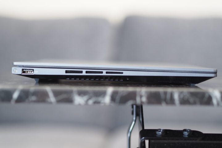 Asus Zenbook 14X OLED left side view showing port and vents.