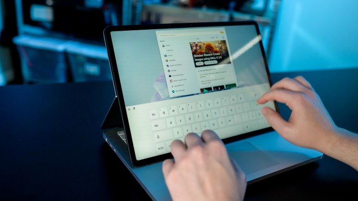 Someone using the Surface Laptop Studio 2's touch screen.