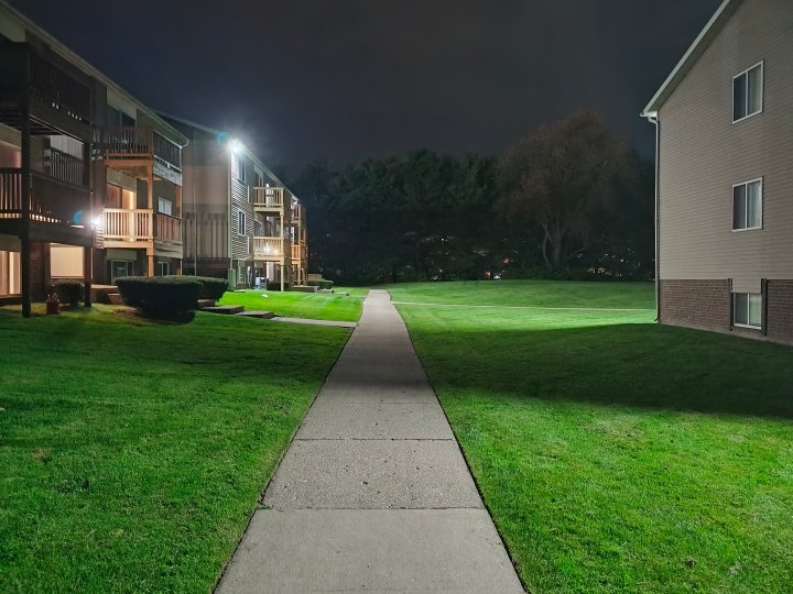 Photo of a sidewalk in an apartment complex at night, taken with the Motorola Edge (2023).