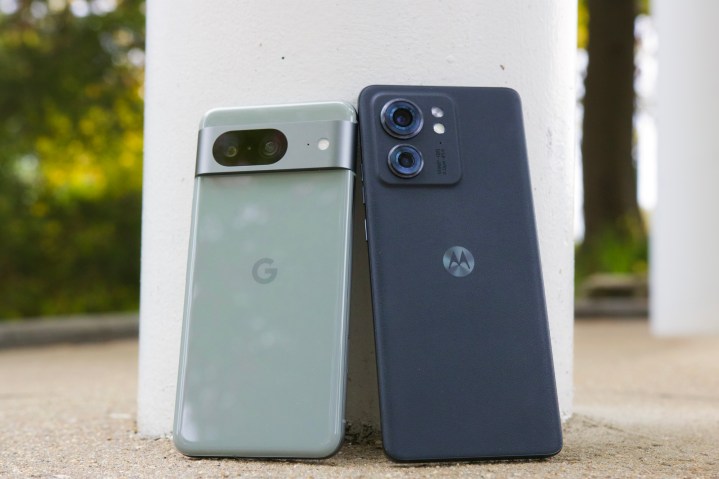 The Google Pixel 8 and Motorola Edge (2023) standing next to each other.